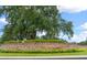 Community entrance with brick wall and landscaping at 5430 Nw 34Th St, Ocala, FL 34482