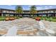 Circular brick patio with comfortable seating, overlooking a community building at 5430 Nw 34Th St, Ocala, FL 34482
