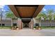 Community entrance with covered walkway, brick accents, and seasonal decorations at 5430 Nw 34Th St, Ocala, FL 34482