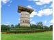 Community entrance with stone monument and landscaping at 5430 Nw 34Th St, Ocala, FL 34482
