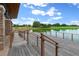 Wooden deck providing serene lake access with scenic views at 5430 Nw 34Th St, Ocala, FL 34482