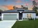 Newly built home with a gray exterior and two-car garage at 16973 Sw 39Th Cir, Ocala, FL 34473