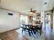 Dining room with a wood table, bench seating, and a view to the backyard at 202 Ellsworth Ct, Kissimmee, FL 34758