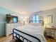 Guest bedroom with queen bed and stylish dresser at 202 Ellsworth Ct, Kissimmee, FL 34758