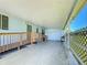 Covered patio with access ramp and storage area at 202 Ellsworth Ct, Kissimmee, FL 34758