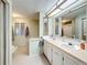 Bathroom with double vanity, shower, and separate tub at 202 Ellsworth Ct, Kissimmee, FL 34758