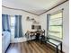 Functional home office space with built-in shelving and a window at 202 Ellsworth Ct, Kissimmee, FL 34758