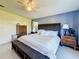 Spacious main bedroom with king bed and ample dresser storage at 202 Ellsworth Ct, Kissimmee, FL 34758