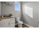 Clean bathroom with granite countertop, white cabinets, and a toilet at 6019 Linneal Beach Dr, Apopka, FL 32703