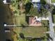 Aerial view of property showing house, lake, and dock at 6019 Linneal Beach Dr, Apopka, FL 32703
