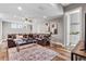 Spacious living room with a leather sectional sofa and a large window at 6019 Linneal Beach Dr, Apopka, FL 32703