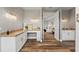 Elegant bathroom with double vanities and a view into the bedroom at 6019 Linneal Beach Dr, Apopka, FL 32703