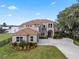 Two-story house with a large yard and lake view at 6019 Linneal Beach Dr, Apopka, FL 32703