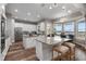 Spacious kitchen with two islands, white cabinets, and stunning lake views at 6019 Linneal Beach Dr, Apopka, FL 32703