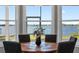 Charming lakefront dining room with wood table and four chairs at 6019 Linneal Beach Dr, Apopka, FL 32703