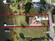 Bird's-eye view of a lakefront home and its surroundings at 6019 Linneal Beach Dr, Apopka, FL 32703