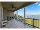 Spacious waterfront deck with lake views and seating area at 6019 Linneal Beach Dr, Apopka, FL 32703