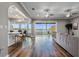 Open living room with water view, hardwood floors, and neutral decor at 6019 Linneal Beach Dr, Apopka, FL 32703