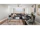 Open living area with a comfortable sectional sofa and wood floors at 6019 Linneal Beach Dr, Apopka, FL 32703
