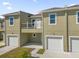 Modern townhouse with attached garage and balcony at 454 Lake Shore Pkwy, Davenport, FL 33896