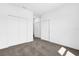 Simple bedroom with carpet flooring and double door closet at 454 Lake Shore Pkwy, Davenport, FL 33896