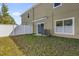 Small backyard with a privacy fence and grassy area at 454 Lake Shore Pkwy, Davenport, FL 33896