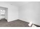 Spacious bedroom with carpet flooring and access to bathroom at 454 Lake Shore Pkwy, Davenport, FL 33896