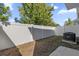Small backyard with a privacy fence and grassy area at 454 Lake Shore Pkwy, Davenport, FL 33896
