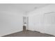 Simple bedroom with tile flooring and access to another room at 454 Lake Shore Pkwy, Davenport, FL 33896