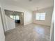 Spacious dining area with tile flooring and view to living room at 4749 Riverwalk Dr, St Cloud, FL 34771