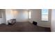 Spacious bonus room with large windows and plush seating at 4749 Riverwalk Dr, St Cloud, FL 34771