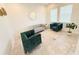 Bright living room with stylish seating and large windows at 4749 Riverwalk Dr, St Cloud, FL 34771