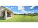 Spacious backyard offering a large grassy area at 4749 Riverwalk Dr, St Cloud, FL 34771