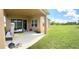 Large backyard with covered patio and grassy area at 4749 Riverwalk Dr, St Cloud, FL 34771