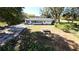 Property showing house, backyard, and surrounding trees at 899 5Th St, Winter Haven, FL 33881