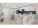 Modern kitchen with white cabinets and quartz countertops at 3131 Paradox Circle 204 # 204, Kissimmee, FL 34746