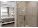 Bathroom with a shower and a view into a bedroom at 3131 Paradox Circle 204 # 204, Kissimmee, FL 34746