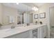 Bathroom with double vanity and white cabinets at 3131 Paradox Circle 204 # 204, Kissimmee, FL 34746