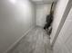 Laundry area with tile flooring and water heater at 703 Galsworthy Ave, Orlando, FL 32809