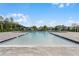 Community swimming pool with spacious deck at 3558 Sandalwood Isle Way, Ocoee, FL 34761