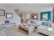 Open living room with sectional sofa and view of kitchen at 3558 Sandalwood Isle Way, Ocoee, FL 34761
