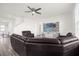 Spacious living room with sectional sofa and large TV at 399 Talisi Loop, Saint Cloud, FL 34771