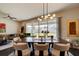 Bright dining room with a large wooden table and access to backyard at 4009 Winding Meadows St, Apopka, FL 32712
