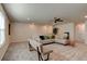 Bright bonus room with sectional sofa and ceiling fan at 4009 Winding Meadows St, Apopka, FL 32712