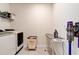 Convenient laundry room with washer, dryer, and ironing board at 4009 Winding Meadows St, Apopka, FL 32712