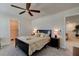 Spacious bedroom with carpeted floor, walk-in closet, and ceiling fan at 4009 Winding Meadows St, Apopka, FL 32712