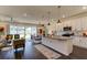 Open concept kitchen with island, stainless steel appliances, and ample cabinet space at 4009 Winding Meadows St, Apopka, FL 32712