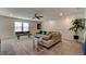 Open bonus room with sectional sofa and ample natural light at 4009 Winding Meadows St, Apopka, FL 32712