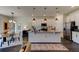 Open concept kitchen with island, stainless steel appliances, and granite countertops at 4009 Winding Meadows St, Apopka, FL 32712