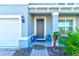 Charming house exterior with a dark brown front door and landscaping at 4009 Winding Meadows St, Apopka, FL 32712